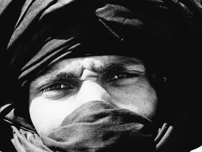 Portrait of a local Saharan guide wearing a desert turban