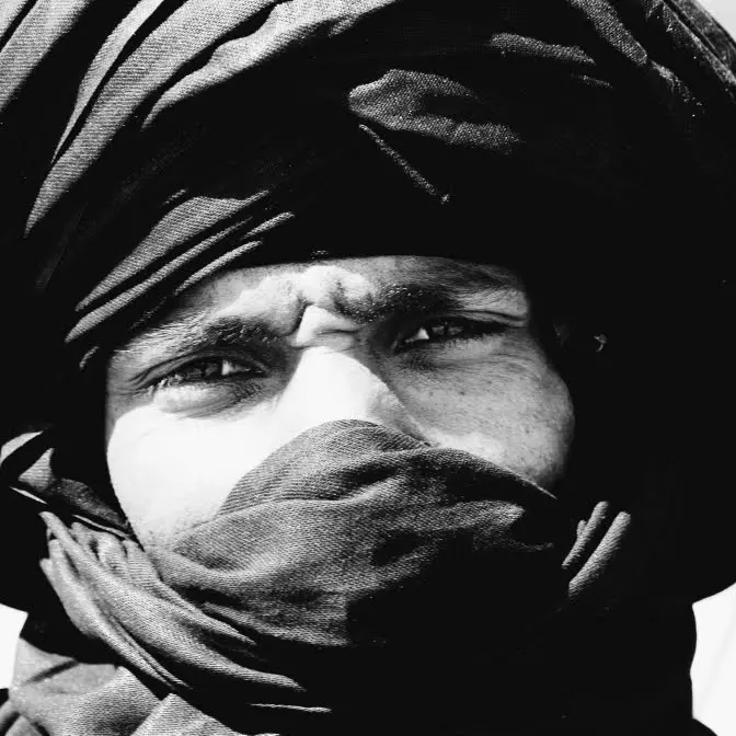Portrait of a local Saharan guide wearing a desert turban