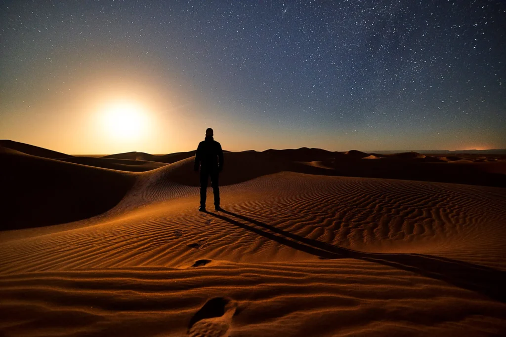 Sahara dunes under a deep night sky